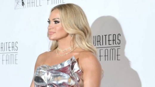 ‘she-has-better-taste-than-that!’:-fans-react-to-carrie-underwood-showing-legs-in-high-slit-metallic-dress