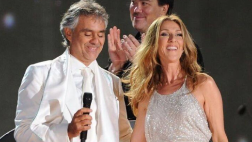 andrea-bocelli,-dressed-in-a-clean-white-suit,-awaits-a-special-guest-onstage-celine-dion-appears-unexpectedly-in-a-glittering-silver-dress.